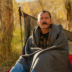 Arcturus Military Wool Blanket on couch adds cozy, durable home comfort.