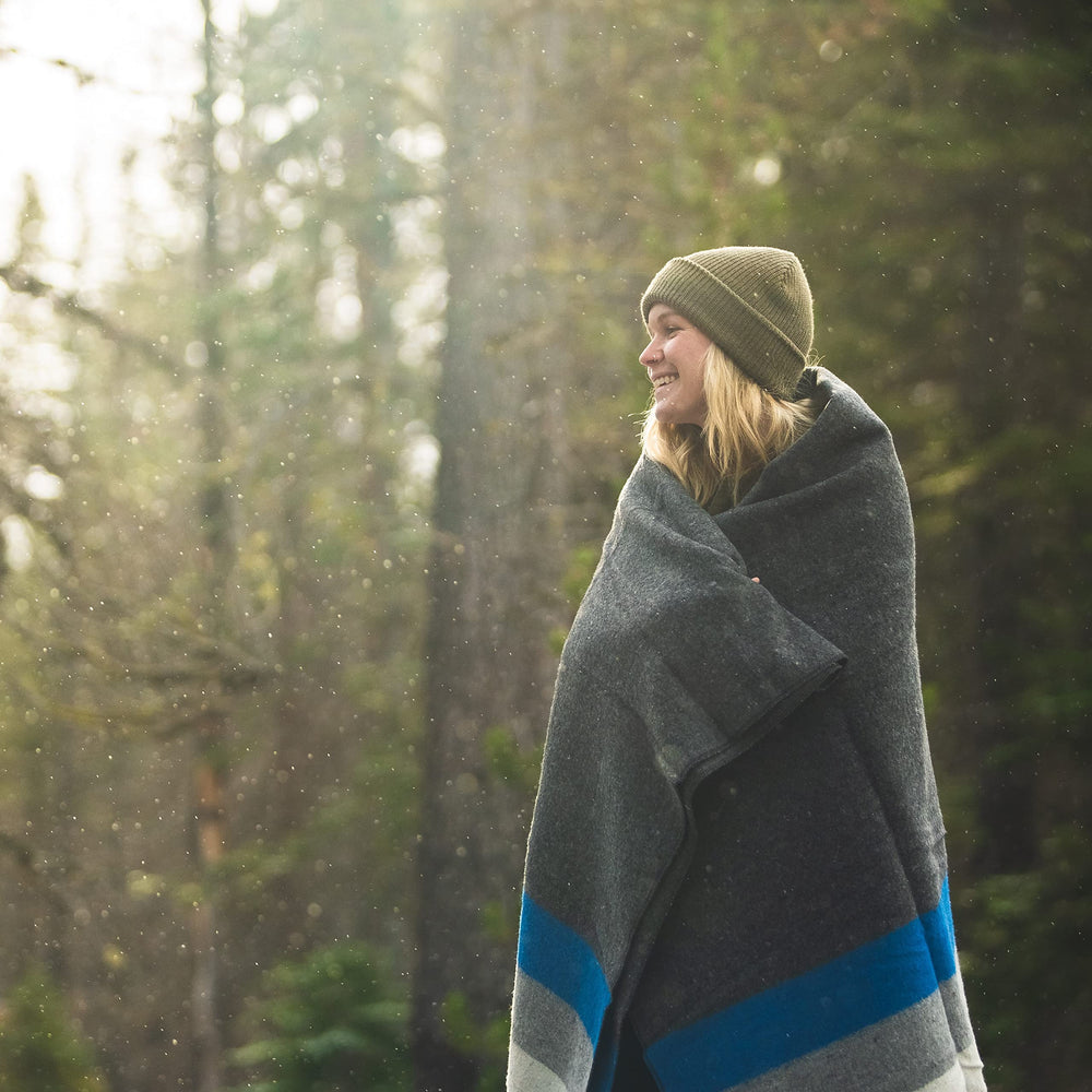 Arcturus Rainier Blanket spread wide to cover two people during camping.