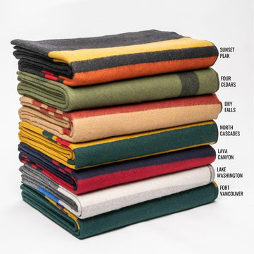 Arcturus Rainier Blanket rolled in bag for easy travel transport.
