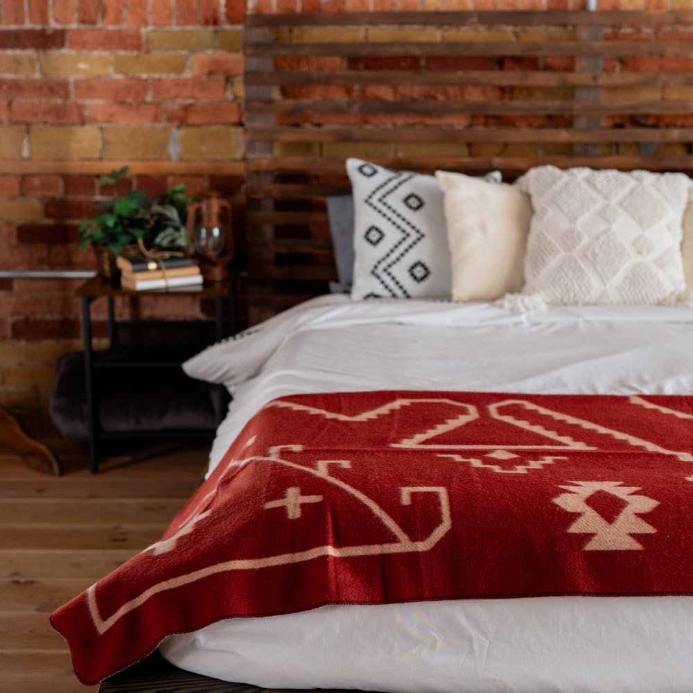 Arcturus Rainier blanket folded on bed shows generous sizes for shared warmth