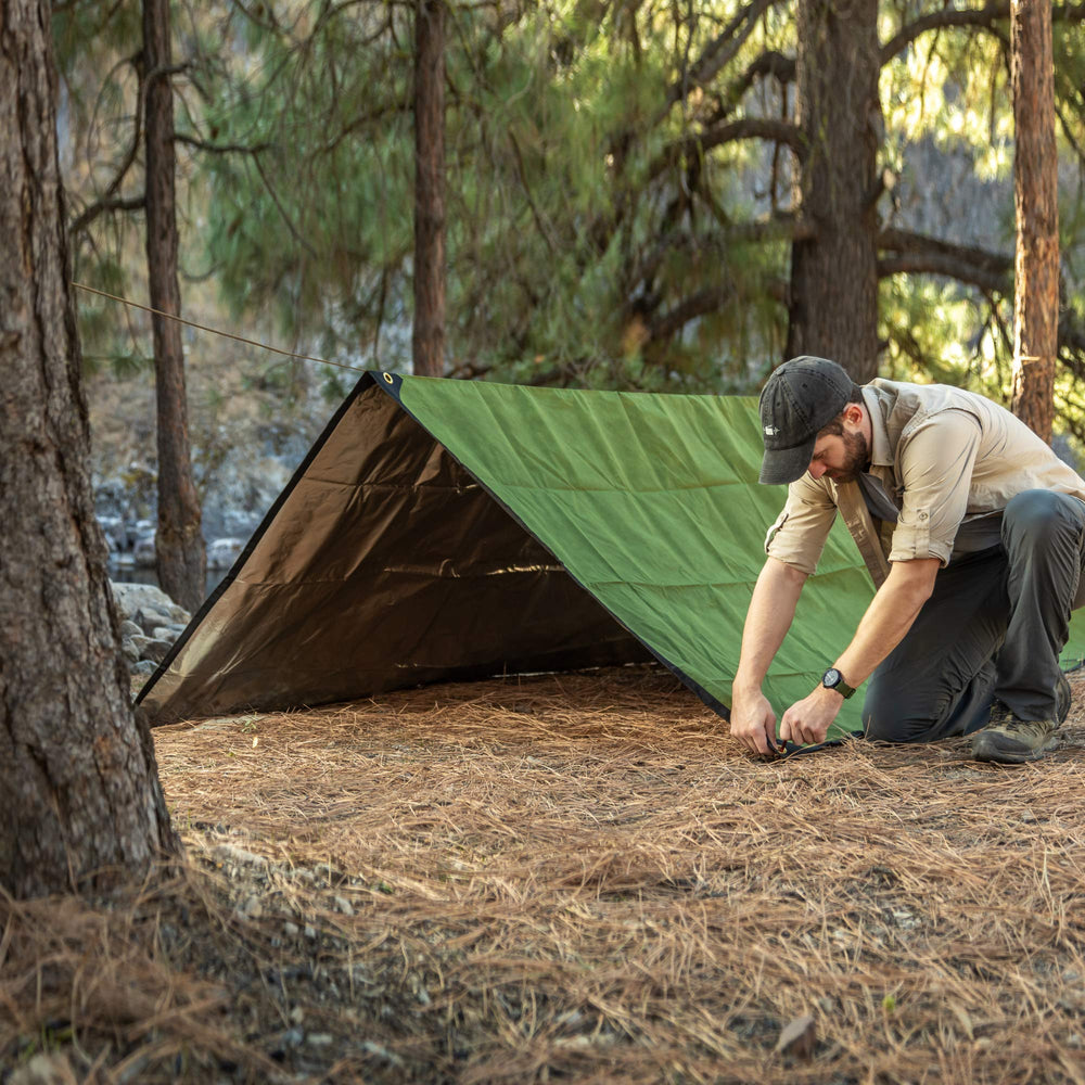 Arcturus XL versatile camping use as tarp or blanket in outdoor scene