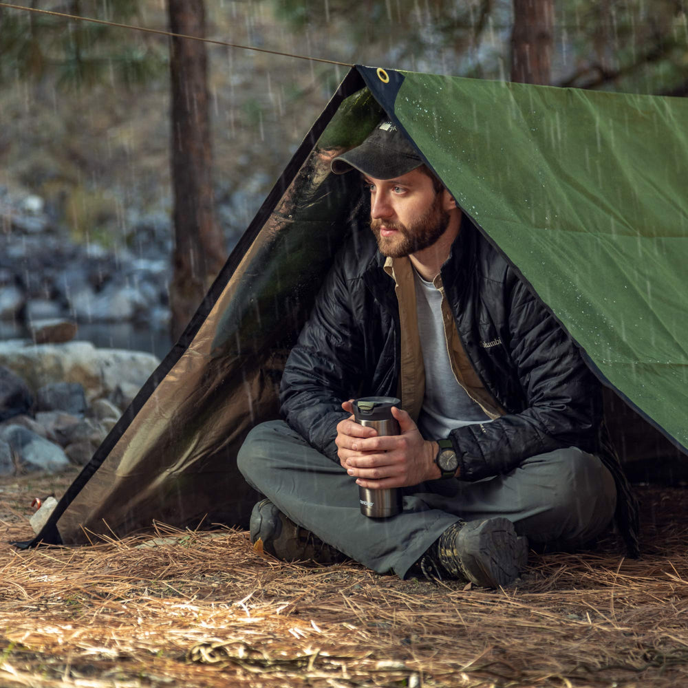 Arcturus XL rugged olive green tarp configured as ground shelter
