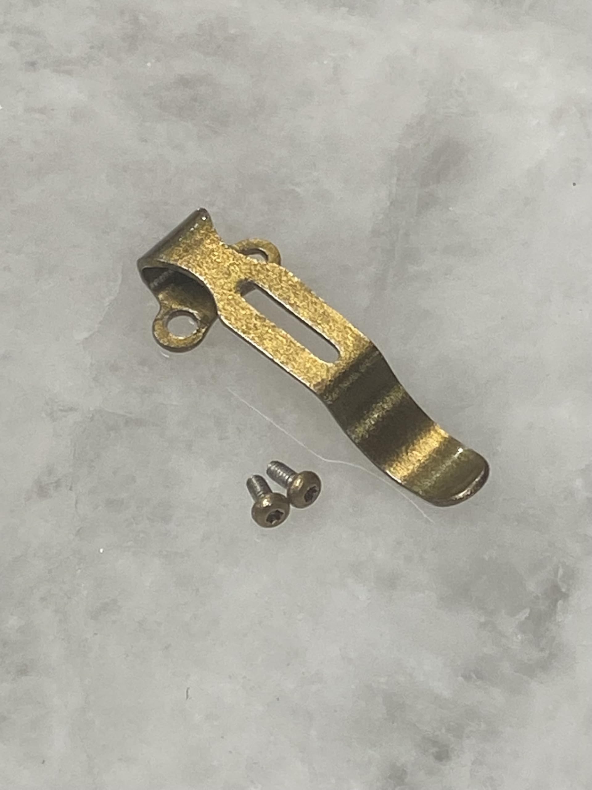 Arkfeld Pro pocket clip in golden bronze finish secures everyday carry