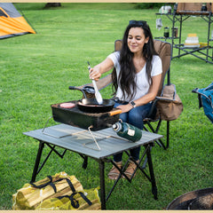 ARROWHEAD OUTDOOR adjustable-height folding table shown in use for versatile dining.