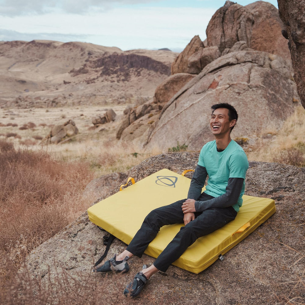 Asana Focus Crash Pad metal cam buckles secure closures during transport.