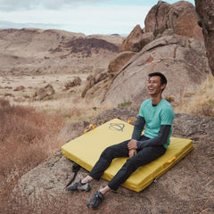 Asana Focus Crash Pad metal cam buckles secure closures during transport.