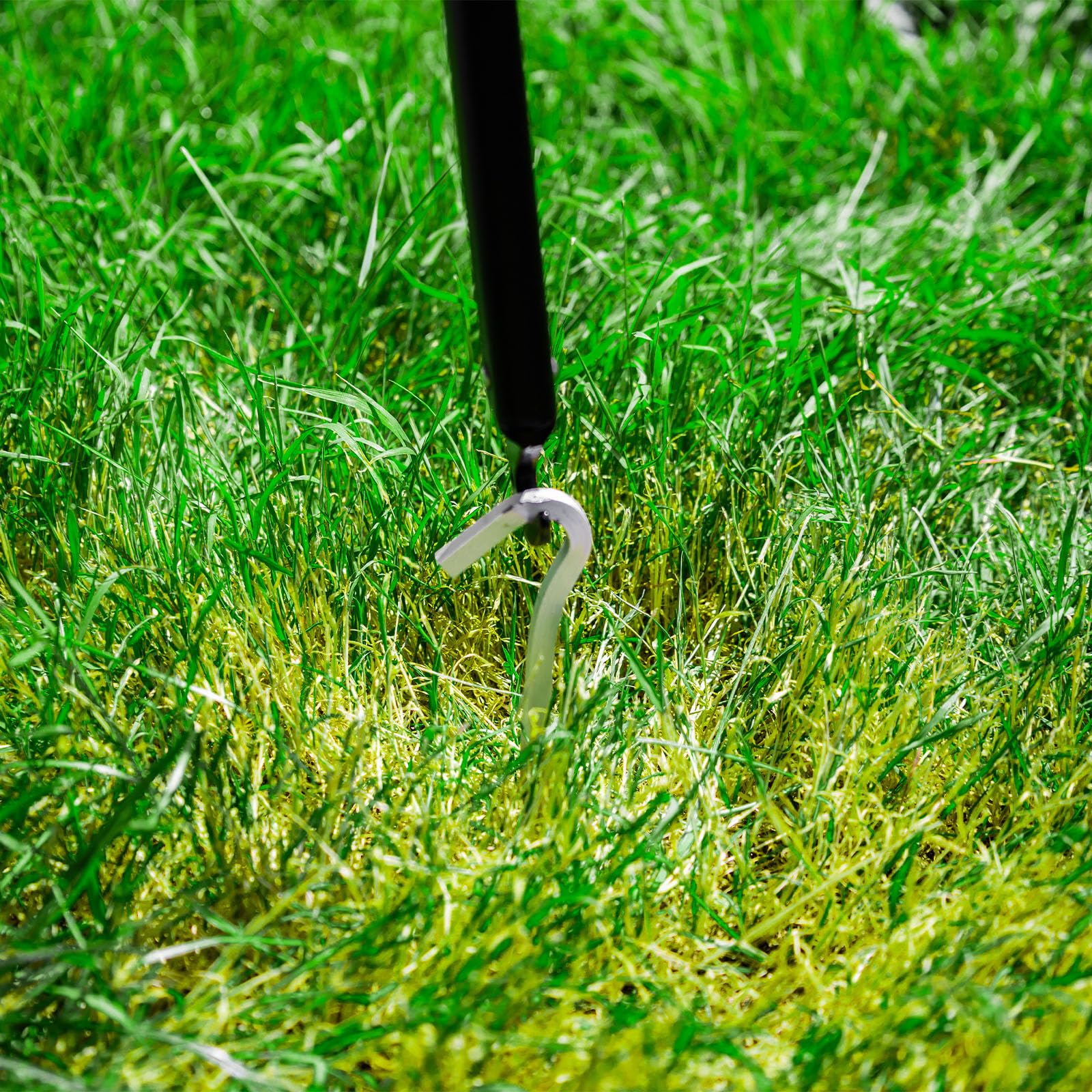 ASR Outdoor use shot shows stake removal at campsite.