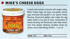 Fluorescent orange cheese-flavored trout eggs in oil-packed jar for trout fishing