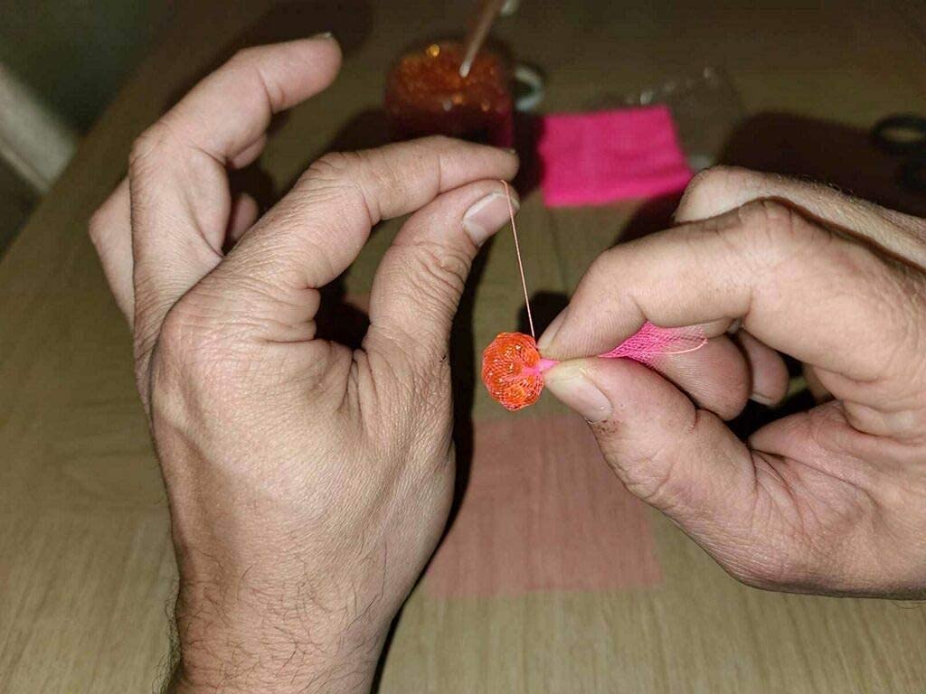 Close-up of wrapping bait with Magic Thread