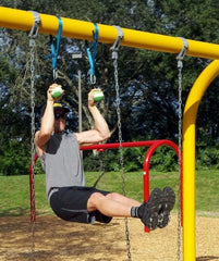 Grip training scene with Atomik balls in red for forearm endurance.