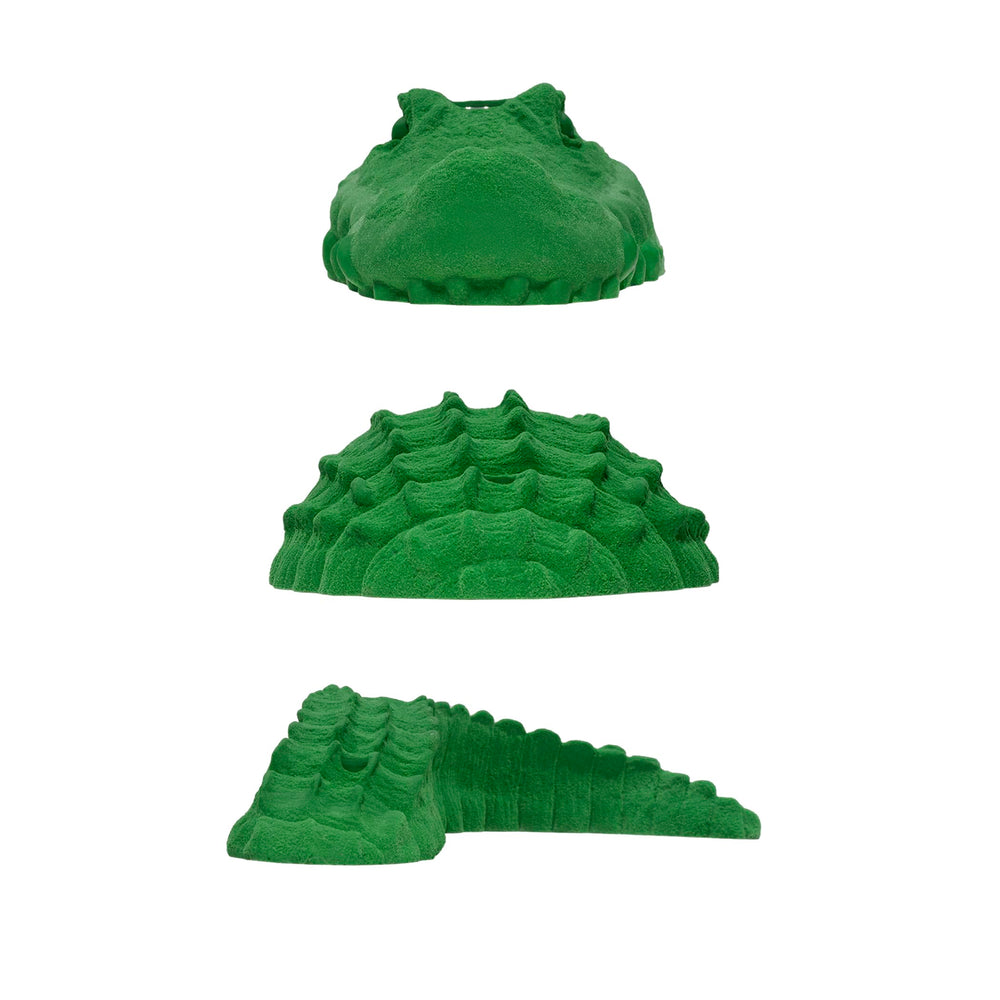 Atomik Alligator tail green hold for full-body reach on climbs