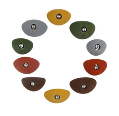 Atomik Rock Holds oval crimps angled view for versatile indoor training