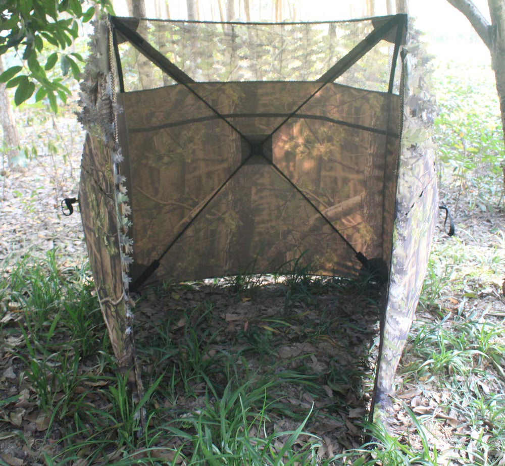 AUSCAMOTEK 3D leaf camouflage at eye level for natural concealment.