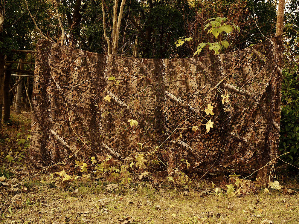 AUSCAMOTEK camo netting sun-blocking backdrop for photography sessions.
