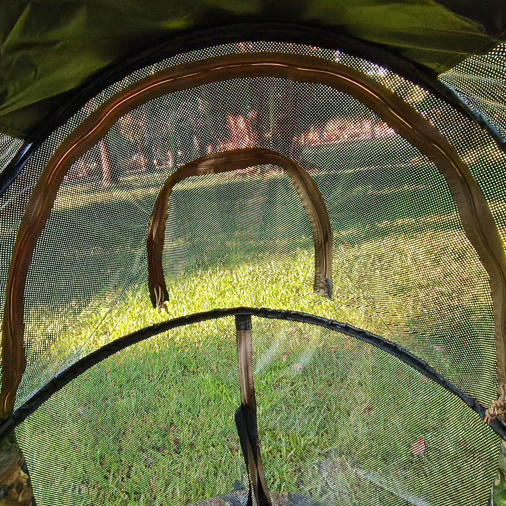 AUSCAMOTEK camouflage pattern blends with natural surroundings for concealment.