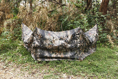 Auscamotek ground blind in woodland brown leaf pattern blends into autumn landscapes for deer and turkey hunting.