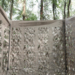 AUSCAMOTEK ground blind in Woodland Brown Leaf pattern blends with autumn leaves.