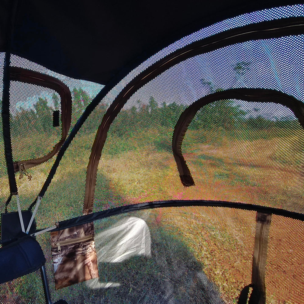 AUSCAMOTEK woodland camouflage blends with surroundings for concealment.