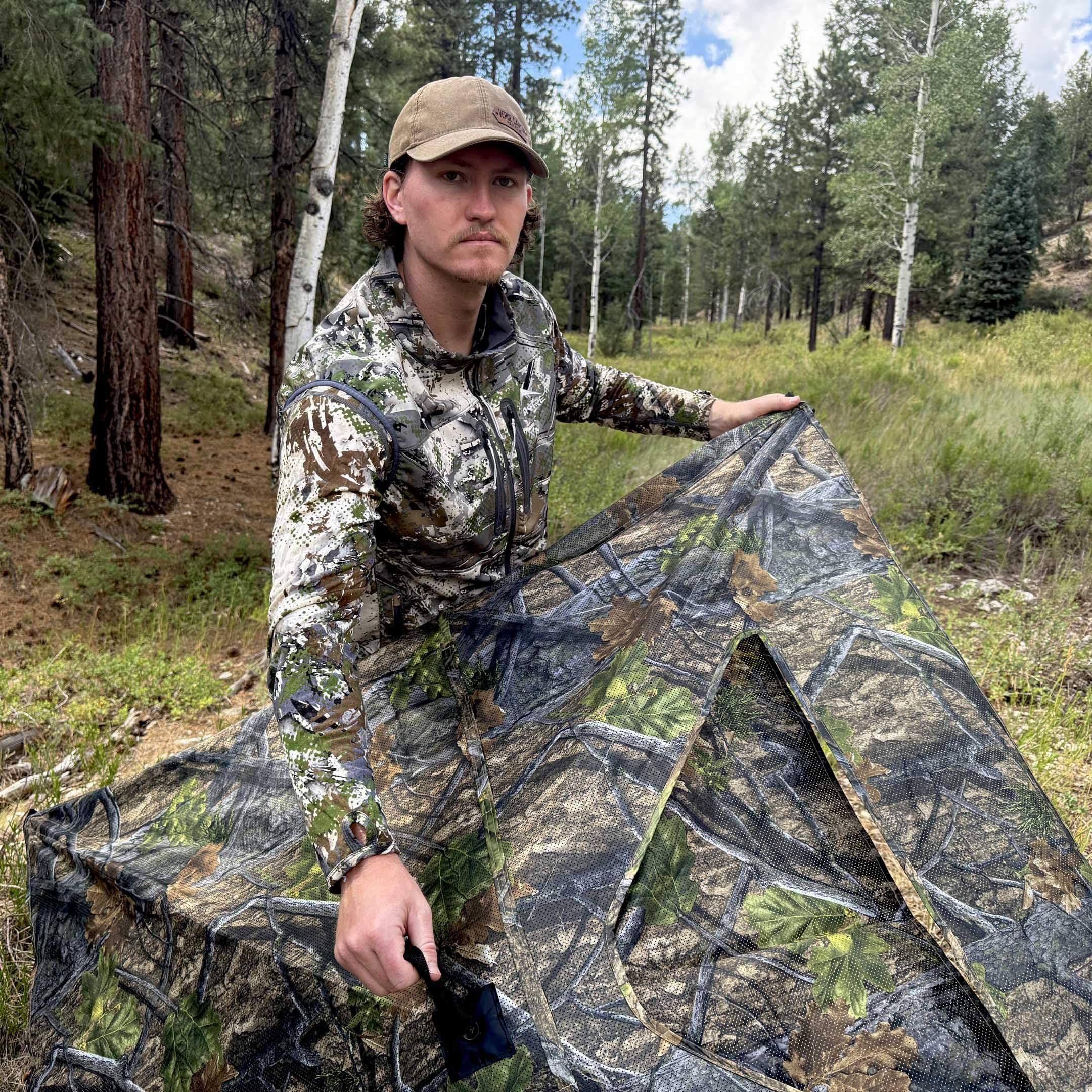 AUSCAMOTEK woodland concealment in dense cover supports deer and turkey hunts.