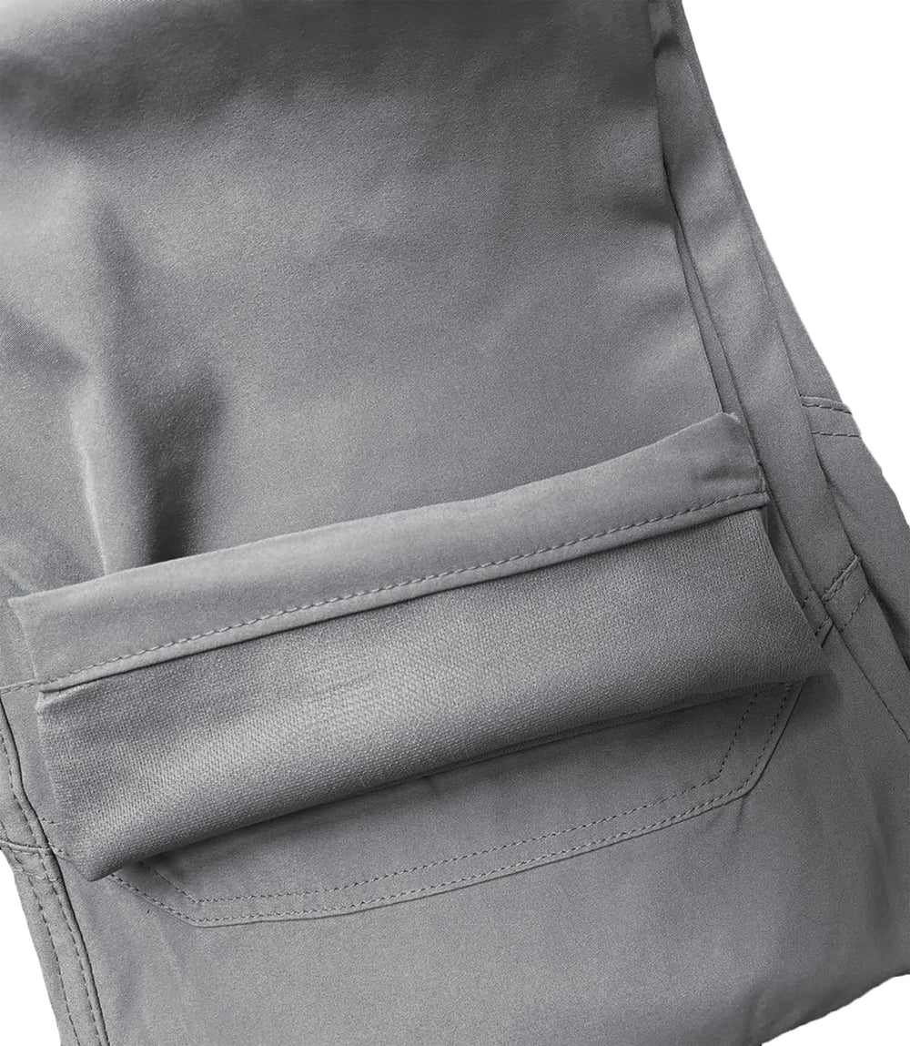 AUTIWITUA rugged cargo pants in action during outdoor adventure.