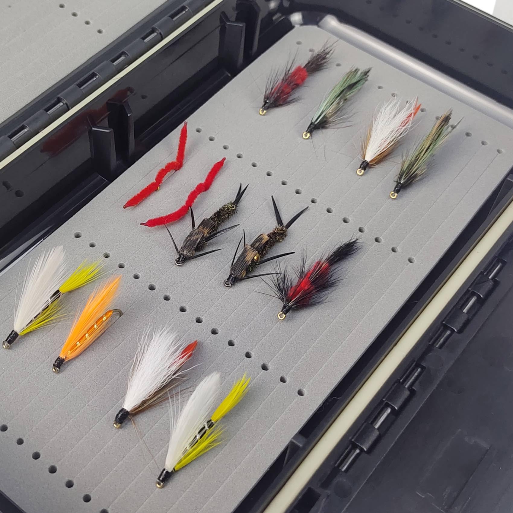 Close-up of double-sided foam grip inside the fly box