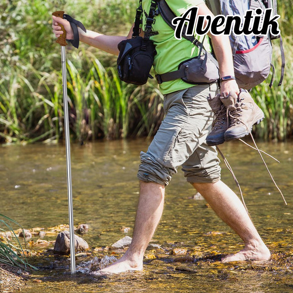Aventik wading staff in swift water showing stability and versatility.