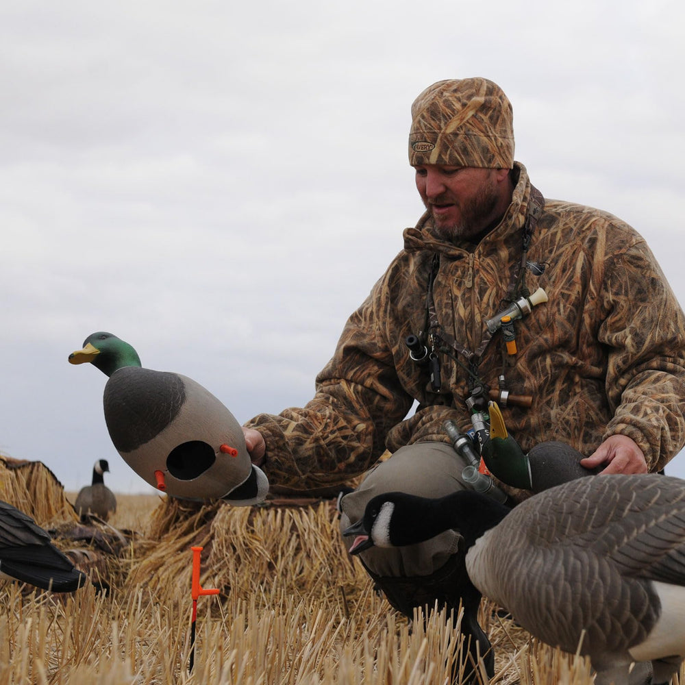 Avery GHG RealMotion stake with motion limiter top controlling wind-driven movement.
