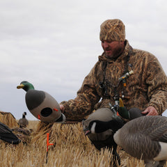 Avery GHG RealMotion stake with motion limiter top controlling wind-driven movement.
