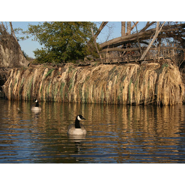 Avery KillerWeed Boat Blind Kit displayed on a marsh hunting setup for concealment.