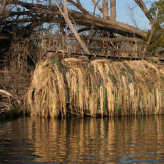 Avery KillerWeed palm fiber bundles ready to cover a boat blind for marsh concealment.