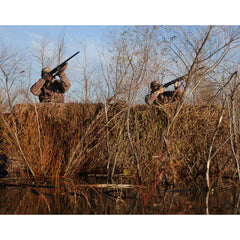Avery RealGrass camouflage mats on a boat blind provide natural concealment.