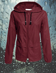 Avoogue women's wine red hooded rain jacket worn for everyday wear and light protection.