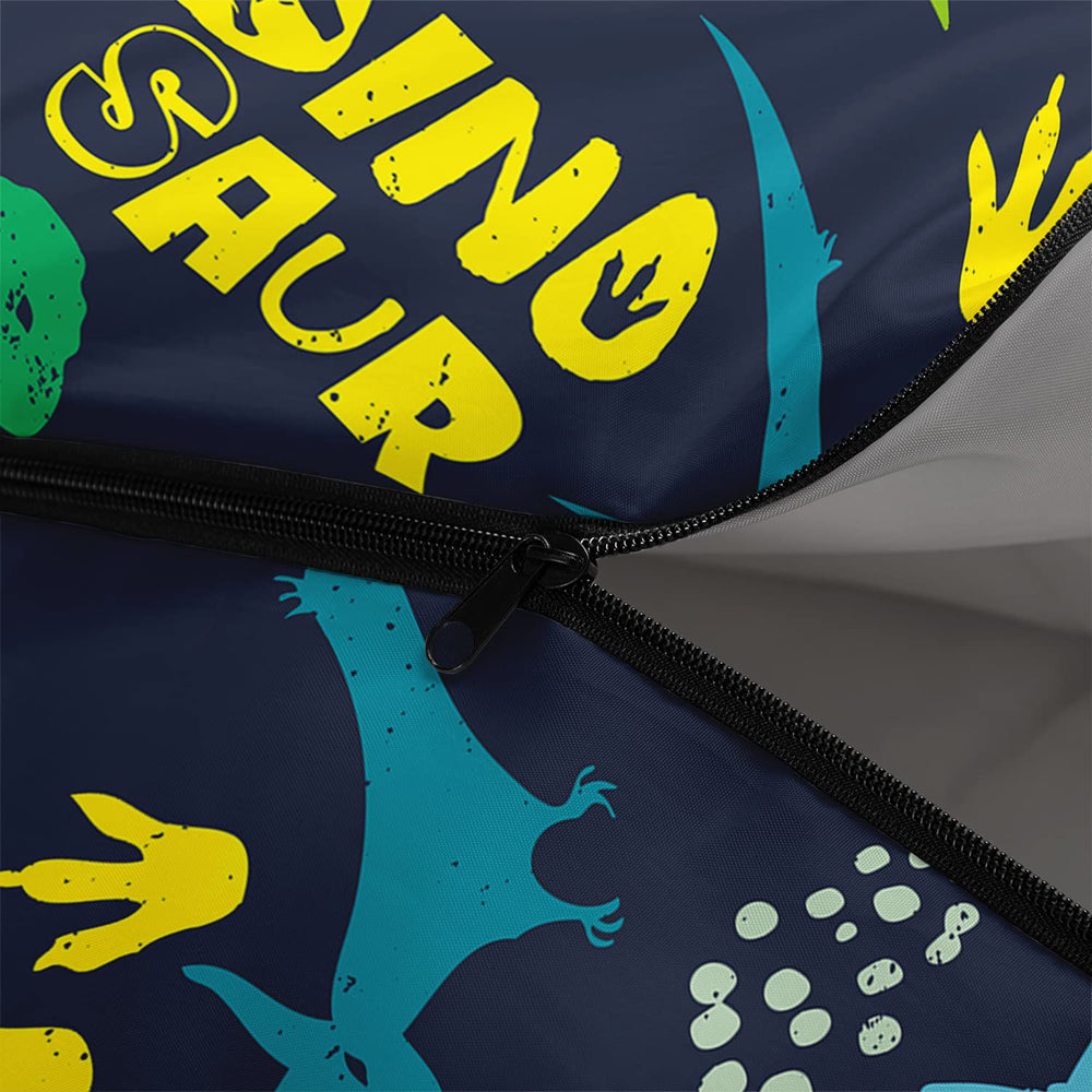 Axolotl blue dinosaur sleeping bag opened as a blanket for picnics.