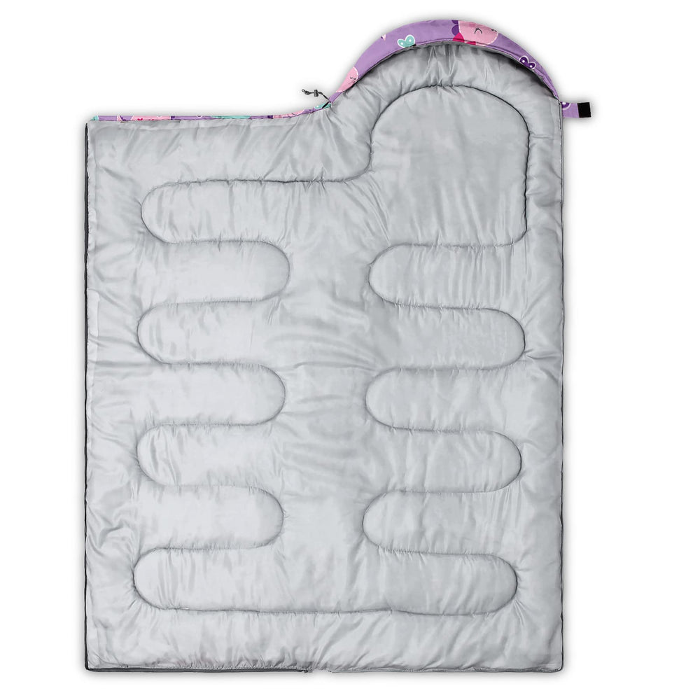 Axolotl pink purple dinosaur sleeping bag folded in compression sack for easy travel.