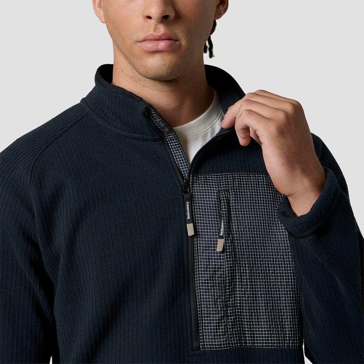 Backcountry Wander Sweater Fleece chest pocket with two-tone ripstop for secure storage.