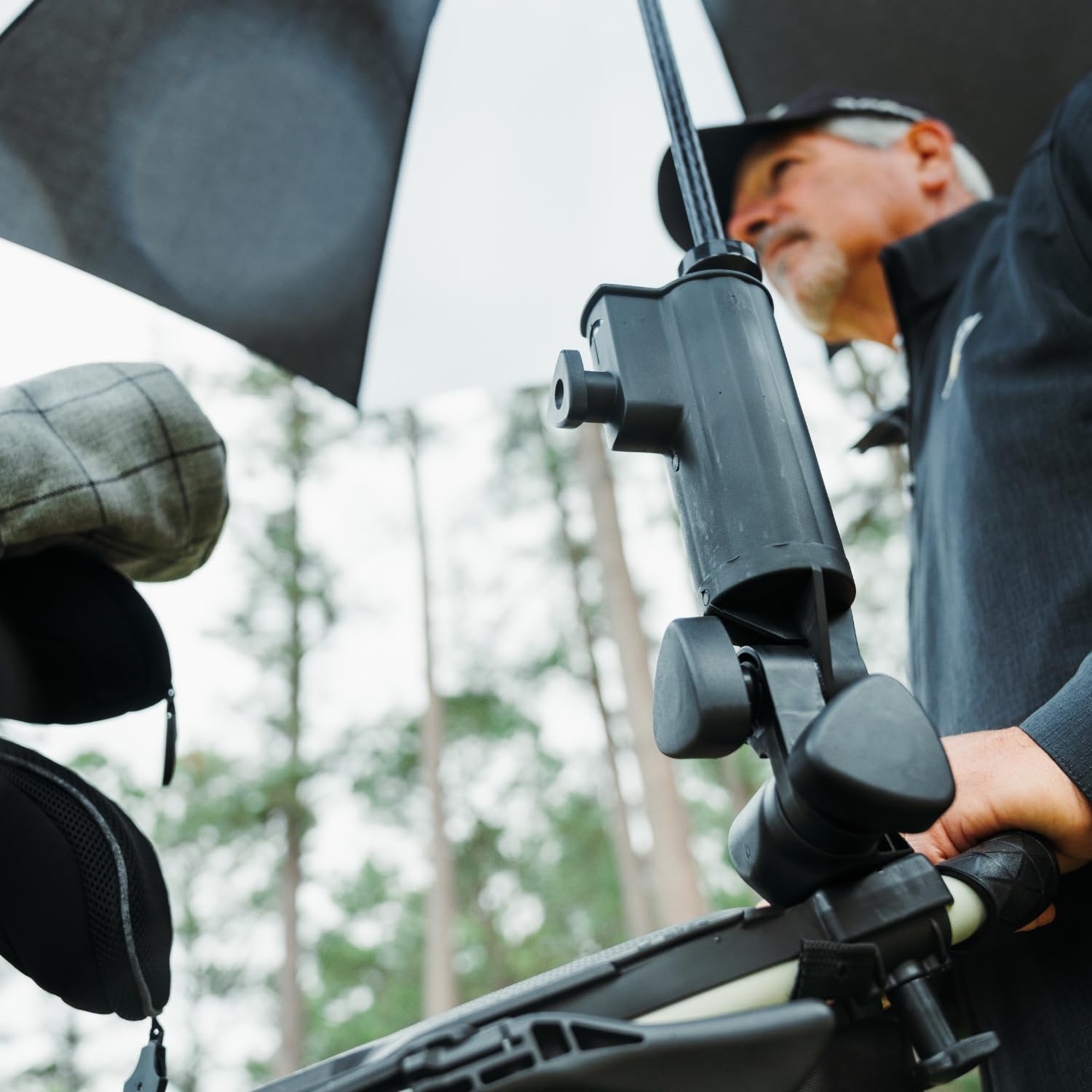 Bag Boy umbrella holder adjustable width adapts to different umbrella handles.