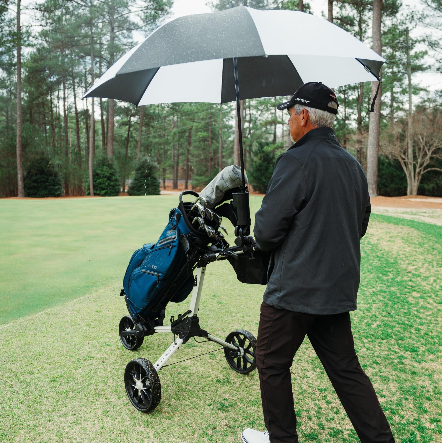 Bag Boy umbrella holder installation guide shows quick tool-free on-course setup.