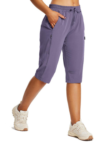 Baleaf below-knee capri hiking shorts on trail offering coverage and comfort.