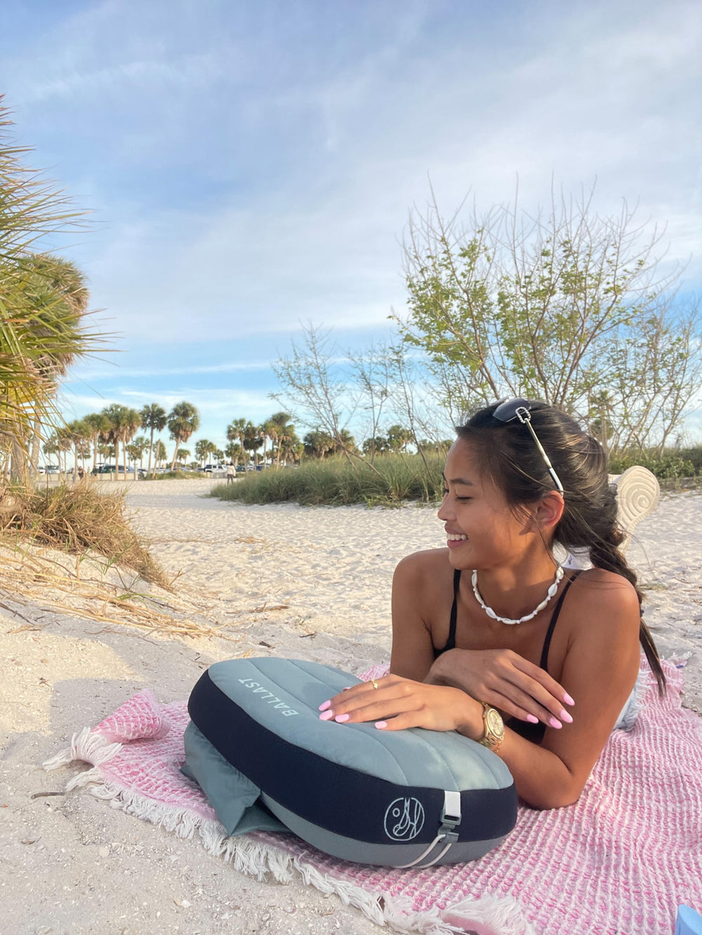 Ballast Beach Pillow contoured bottom supports neck and head during lounges.