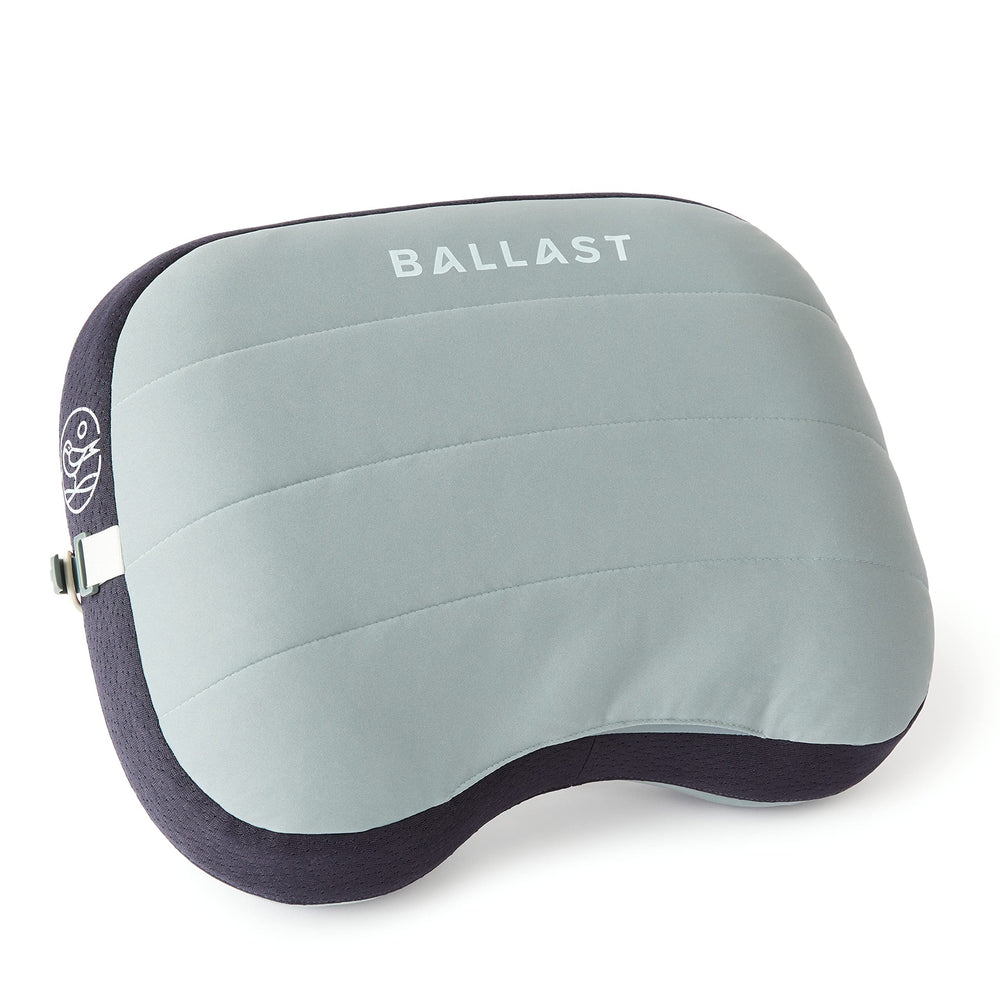 Ballast Beach Pillow inflated on sand provides portable beach comfort.