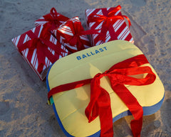 Ballast Beach Pillow inflated on sand for stable, comfortable support.