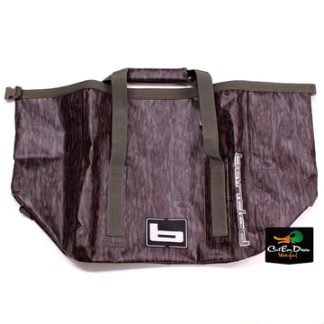 Banded Arc Welded Wader Bag in Mossy Oak Bottomland keeps gear dry and organized for field use