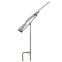 Banded Gun Stick Hands-Free Holder in muddy terrain securing a shotgun for hands-free use