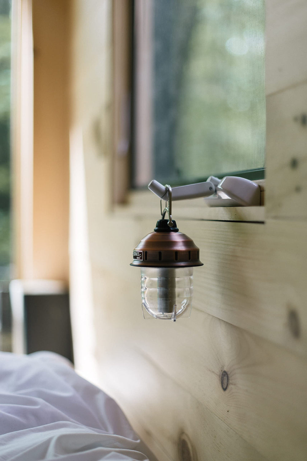 Barebones Beacon hanging light copper portable lighting solution for camping trips and backyard gatherings