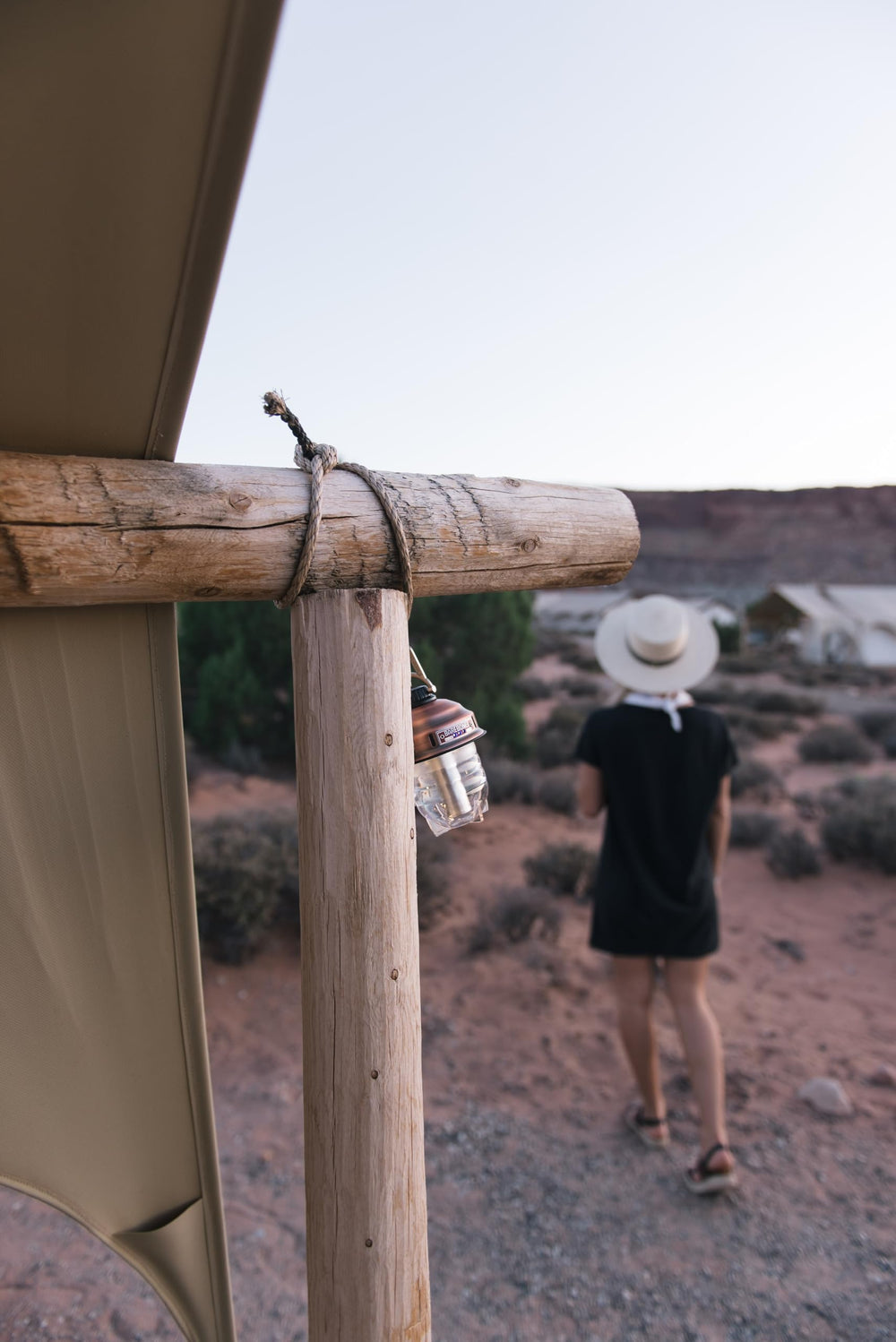 Barebones Beacon hanging light copper warm glow showcases inviting ambience for outdoor dining and gatherings