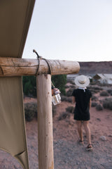 Barebones Beacon hanging light copper warm glow showcases inviting ambience for outdoor dining and gatherings