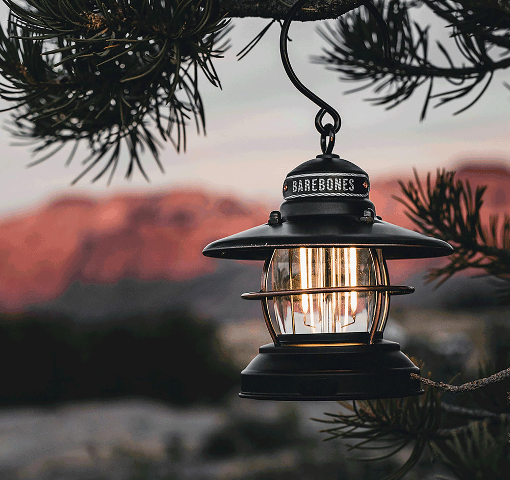 Barebones Edison Mini Lantern slate gray on a shelf adding soft lighting.