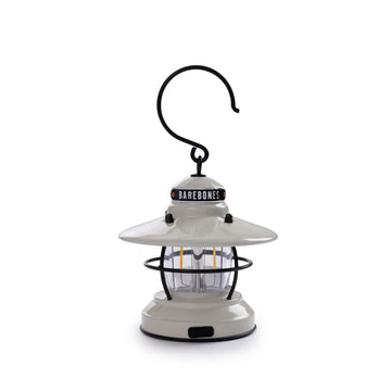 Barebones Edison Mini Lantern in vintage white provides ambient outdoor light for camping.