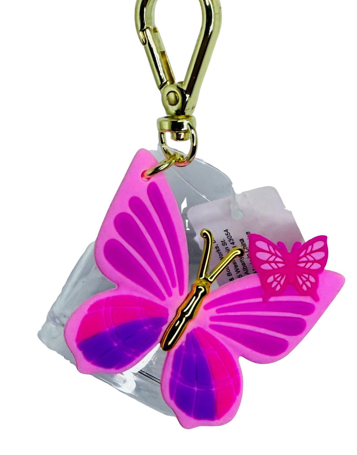 Bath and Body Works PocketBac holder with pink butterflies and a gold clip for on-the-go sanitizing.