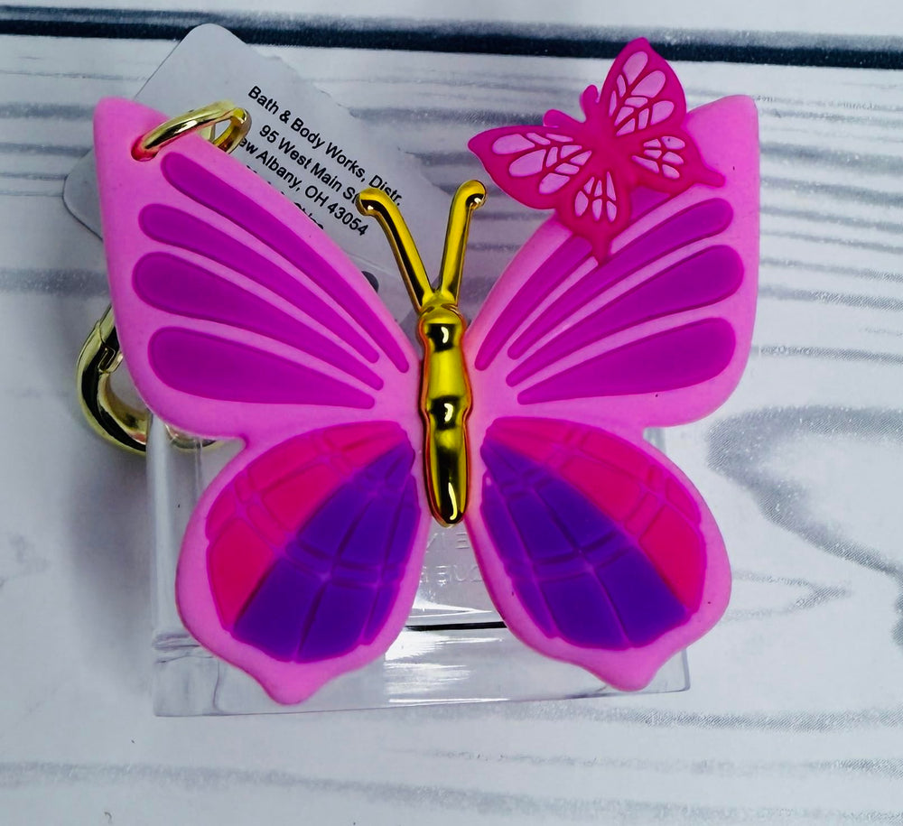 Gold-tone clip detail on Bath and Body Works PocketBac Holder for secure bag attachment.